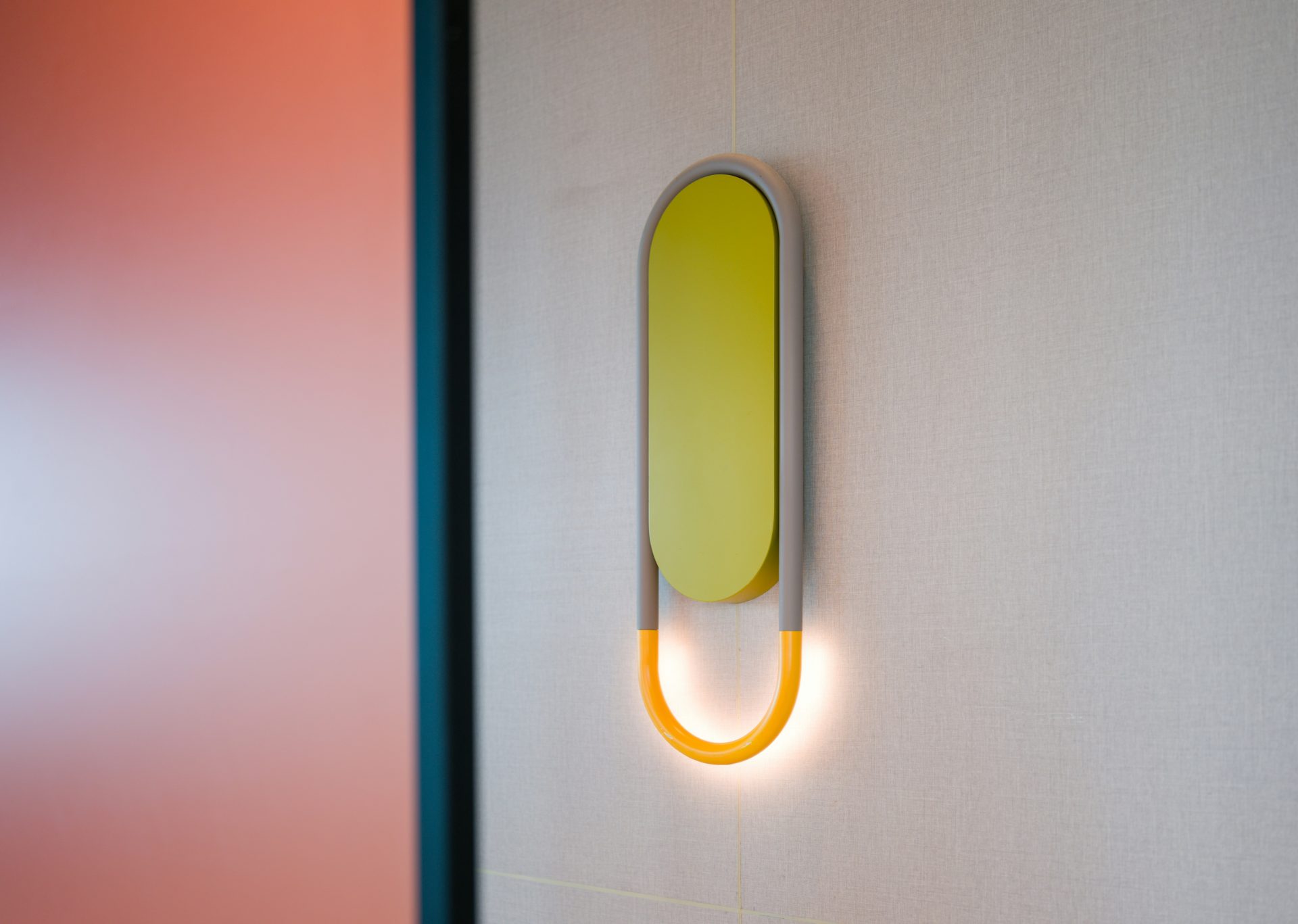 a yellow object is mounted on a wall